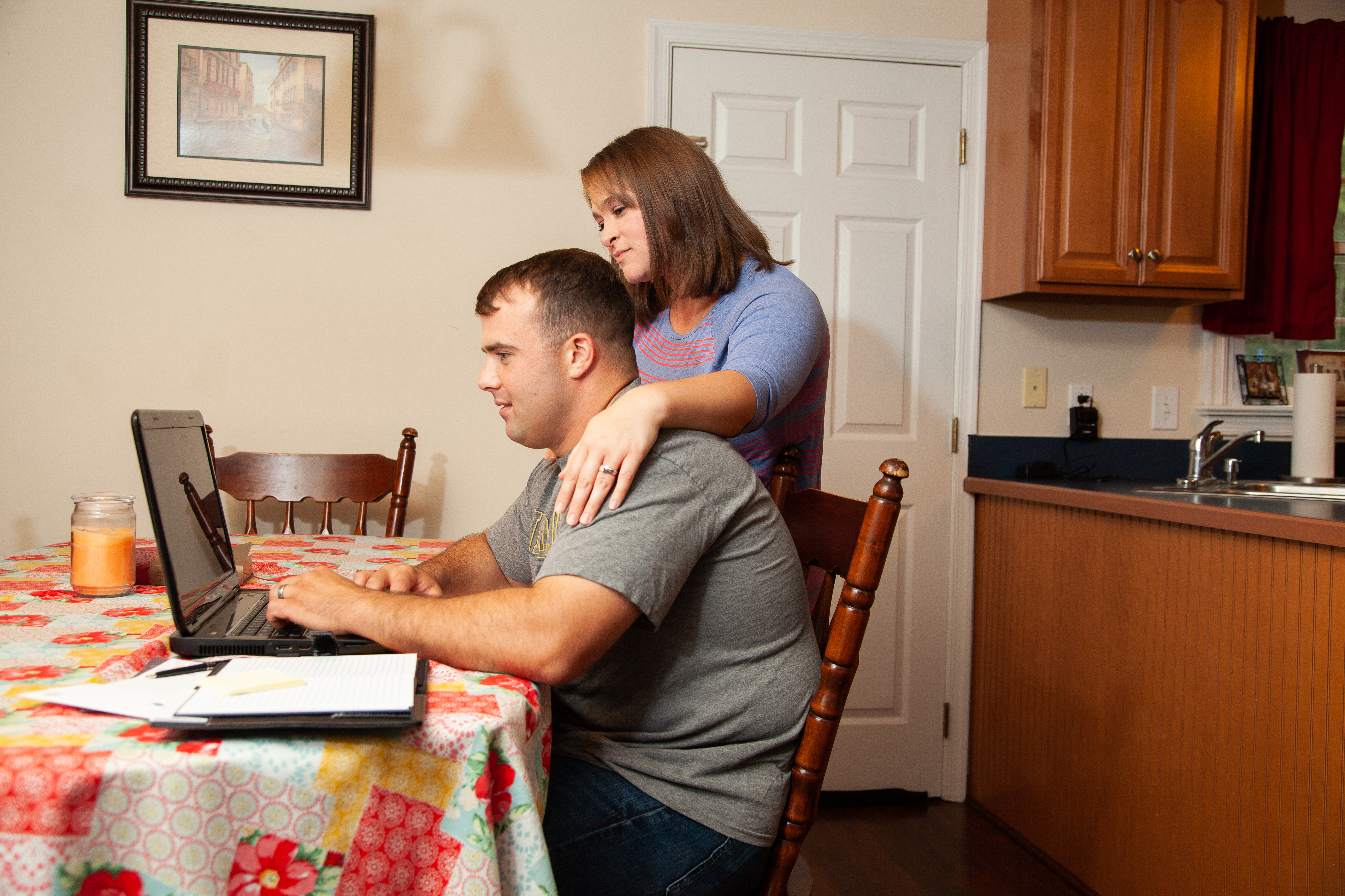 Two people at a computer